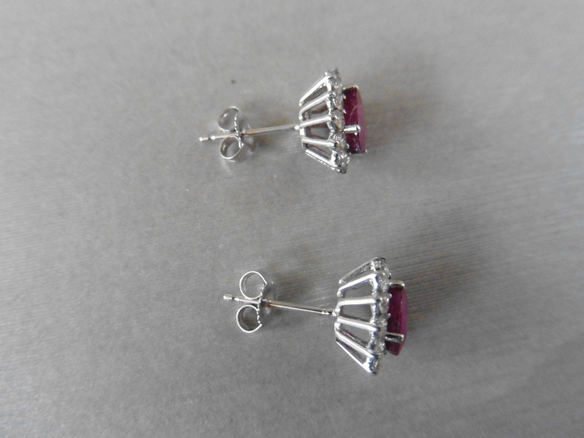 1.60ct ruby and Diamond cluster style stud earrings. Each ruby measures 7mm x 5mm and is - Image 3 of 4
