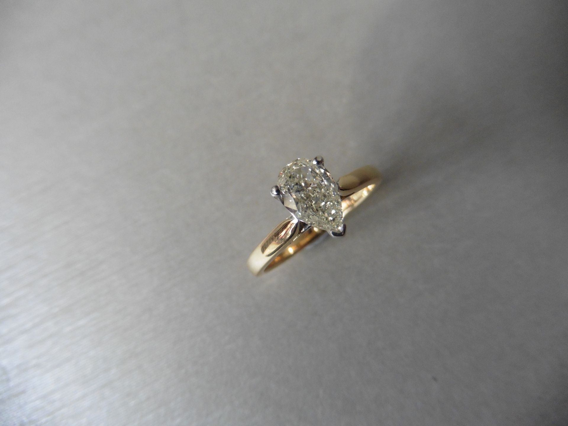 0.81ct pear shaped diamond solitaire ring. J/K colour VS clarity. 3 claw setting in white gold