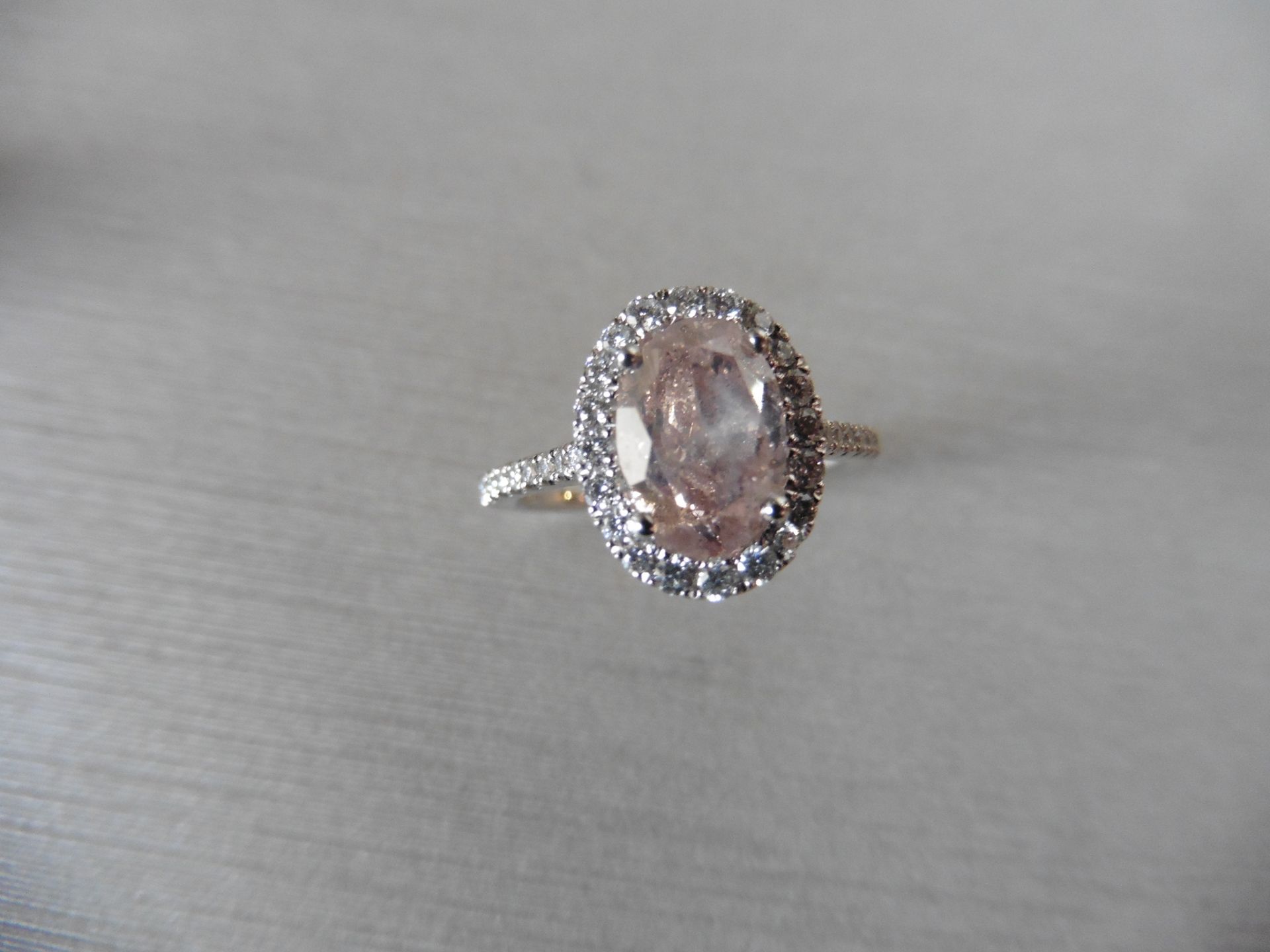 2.35ct diamond set ring with a 2ct pink/ brown oval shaped diamond. This is surrounded with a halo - Image 4 of 5