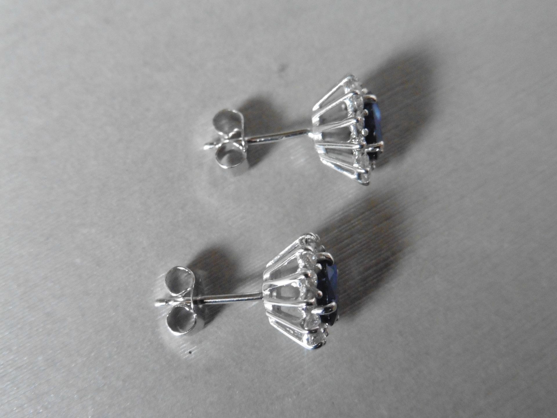 1.60ct Sapphire and Diamond cluster style stud earrings. Each Sapphire measures 7mm x 5mm and is - Image 3 of 4