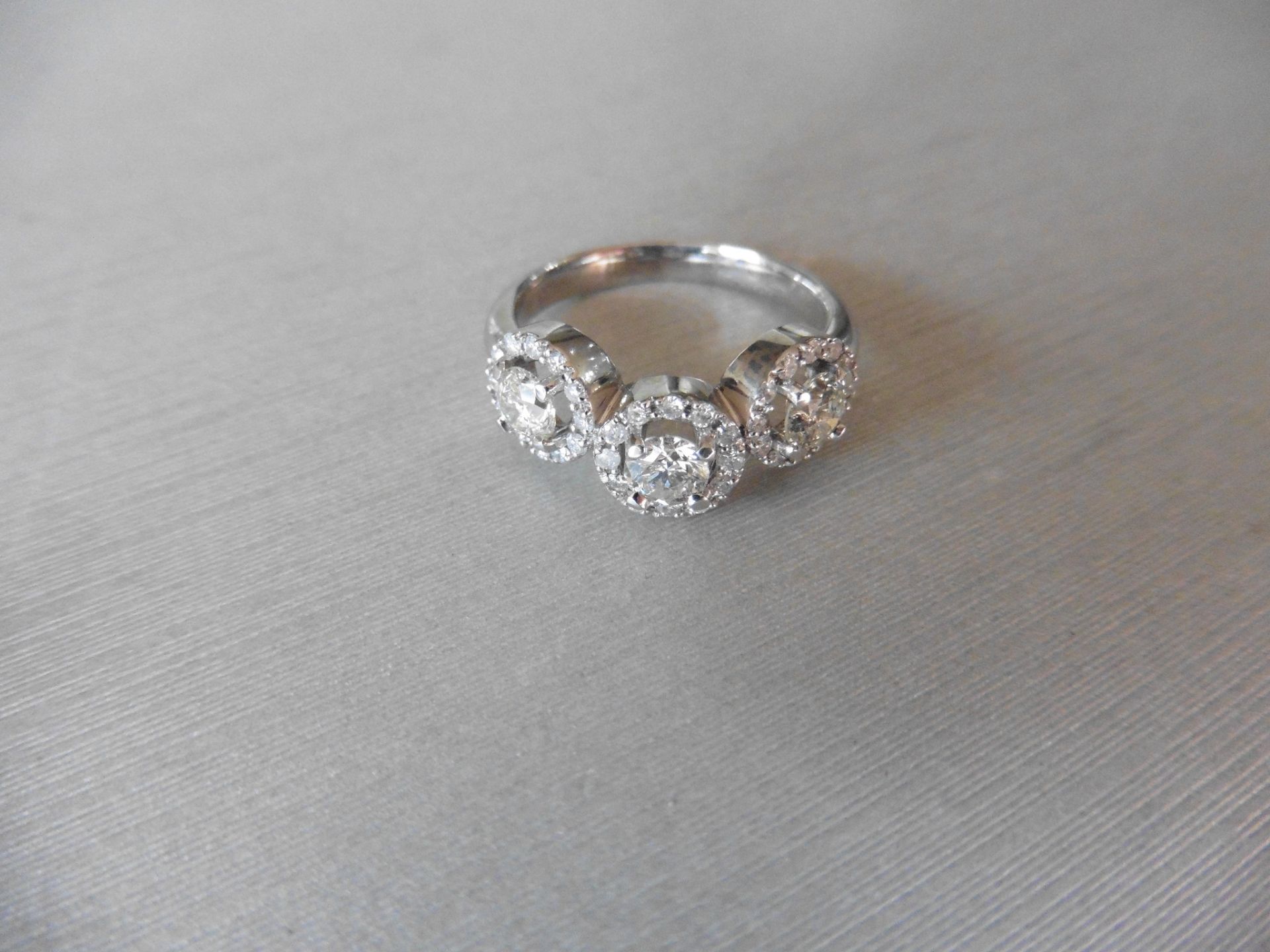 1.03ct diamond halo set trilogy style dress ring. Set with 3 centred brilliant cut diamonds, I - Image 2 of 5