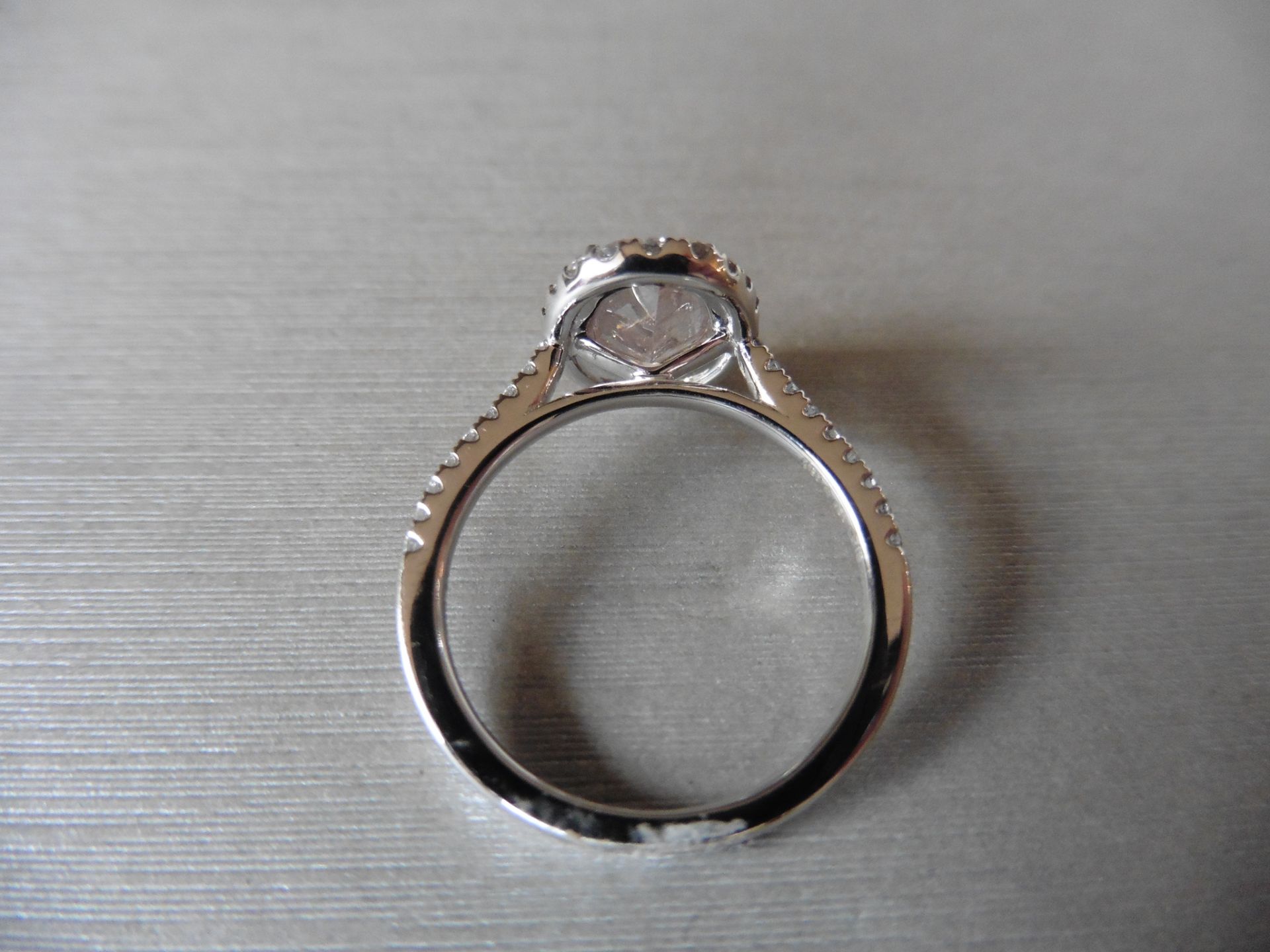 2.35ct diamond set ring with a 2ct pink/ brown oval shaped diamond. This is surrounded with a halo - Image 2 of 5