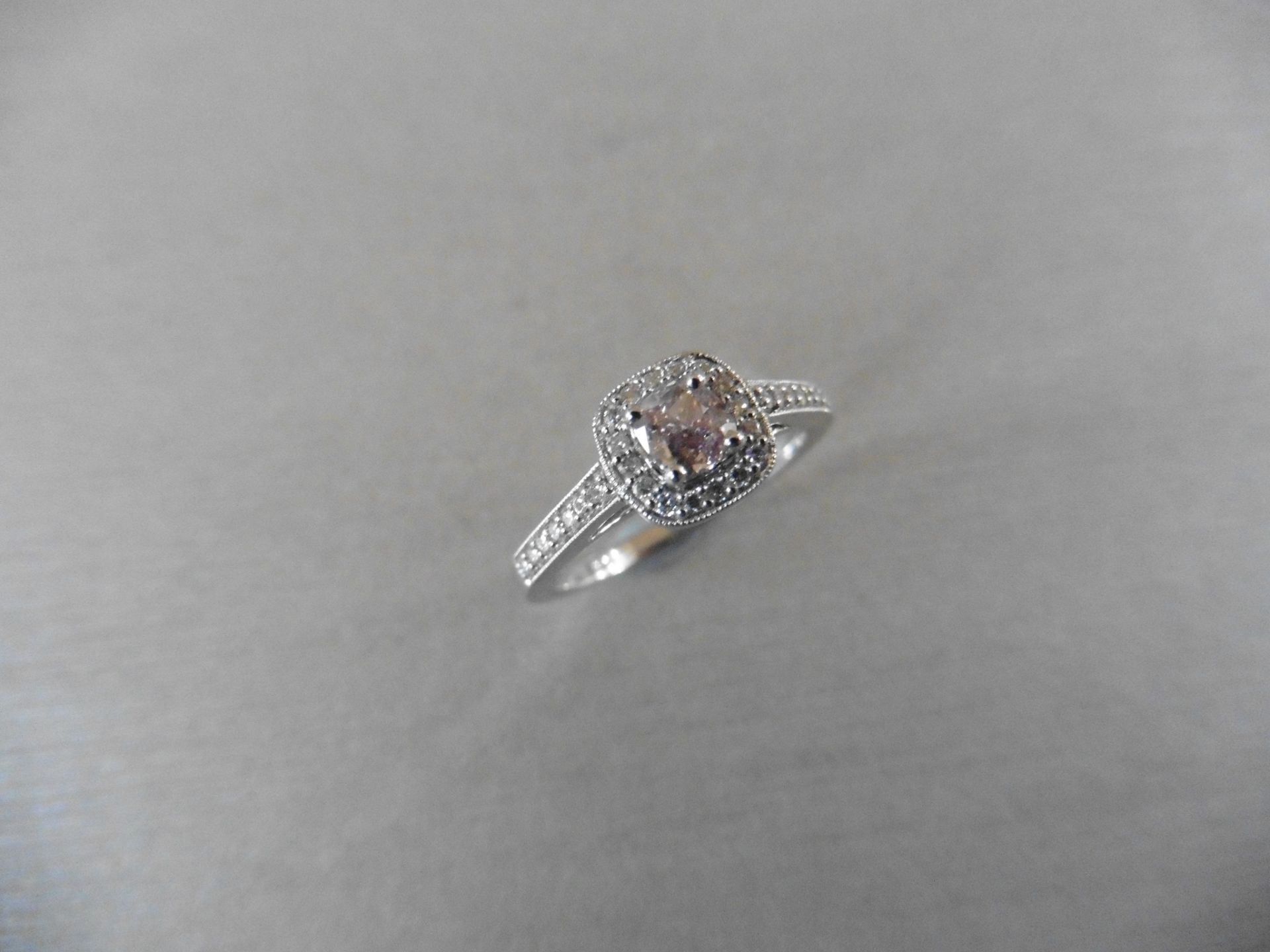0.35ct / 0.18ct diamond set solitaire ring. Centre stone is a pink cushion cut diamond, GIA