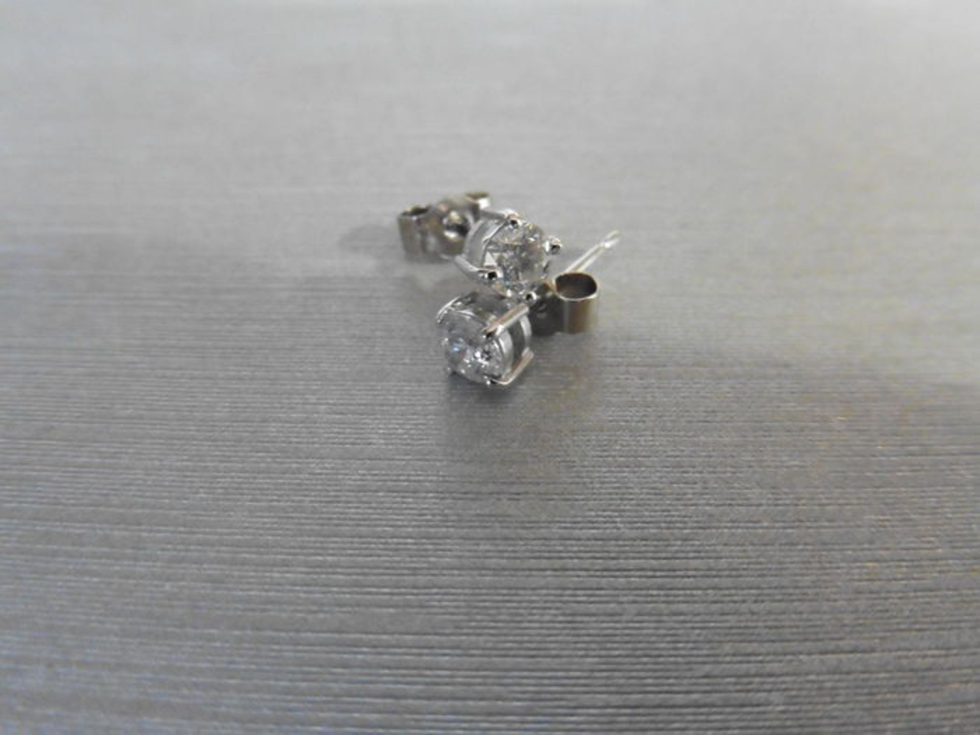 0.50ct Solitaire diamond stud earrings set with brilliant cut diamonds, SI2 clarity and I colour.