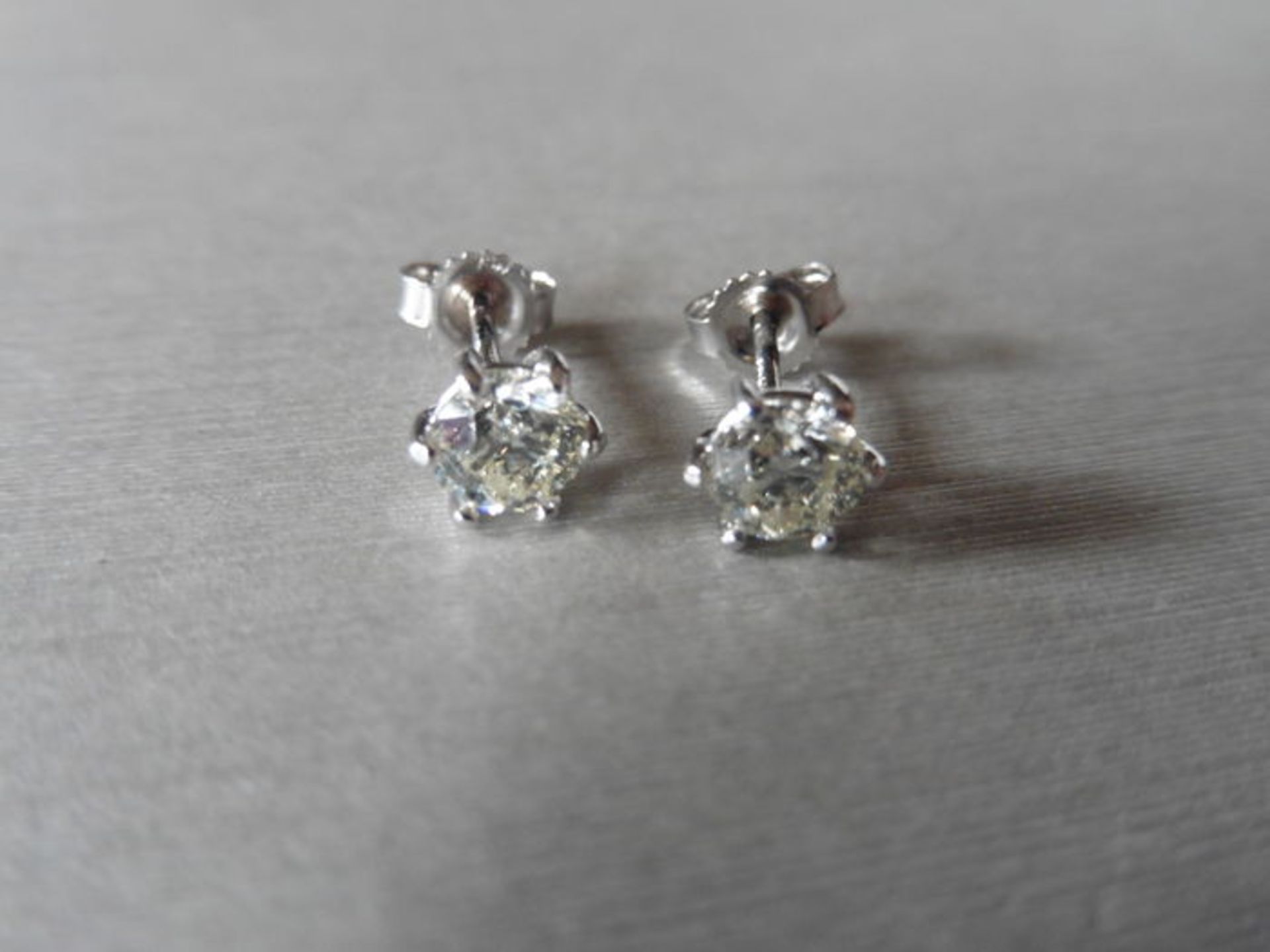 1.40ct Diamond solitaire earrings set with brilliant cut diamonds, I colour SI3 clarity. Six claw