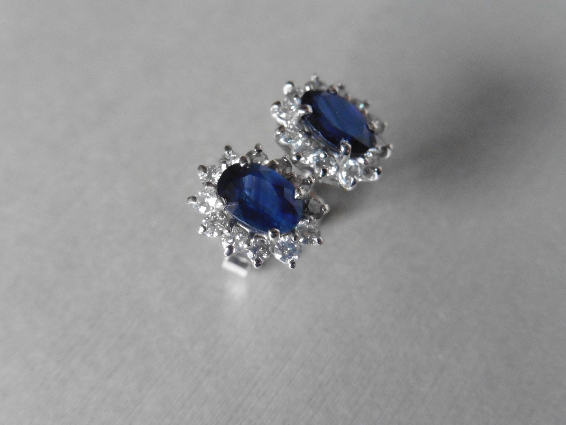 1.60ct Sapphire and Diamond cluster style stud earrings. Each Sapphire measures 7mm x 5mm and is
