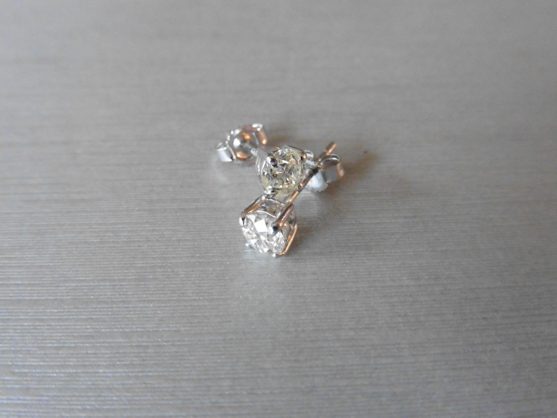 0.60ct Solitaire diamond stud earrings set with brilliant cut diamonds, SI2 clarity and I colour.