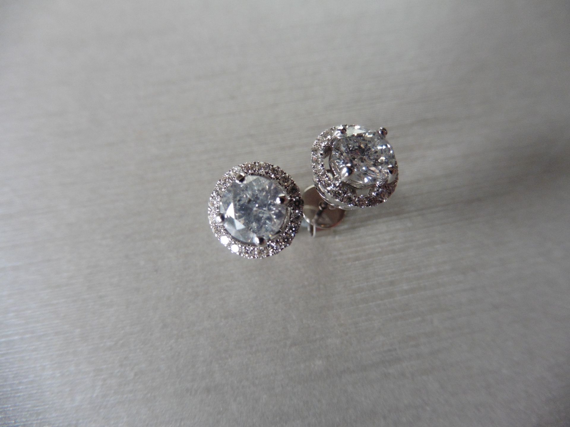 1.50ct Diamond set solitaire style earrings. Each set with 0.75ct brilliant cut diamond, I colour,