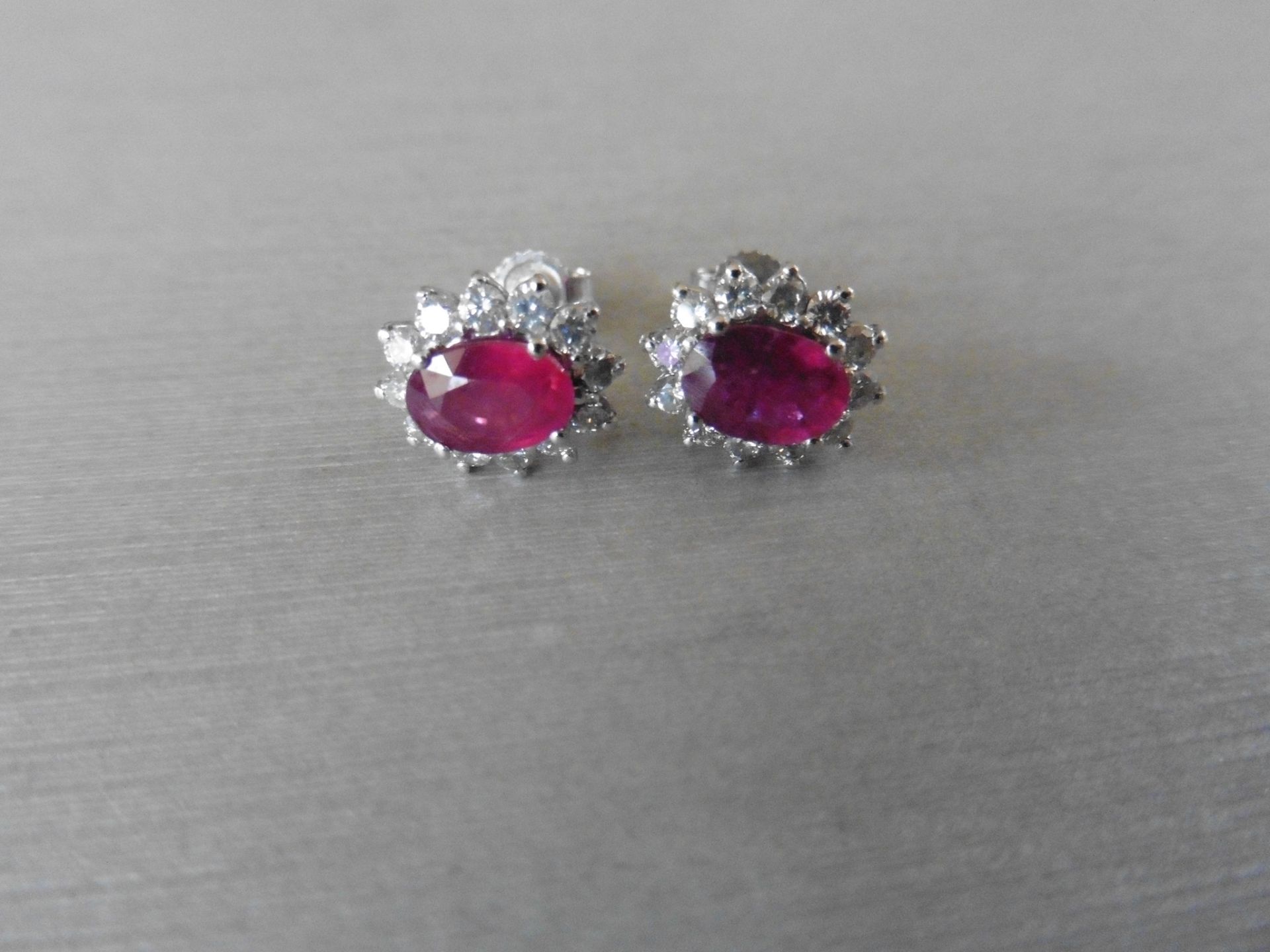1.60ct ruby and Diamond cluster style stud earrings. Each ruby measures 7mm x 5mm and is - Image 2 of 4