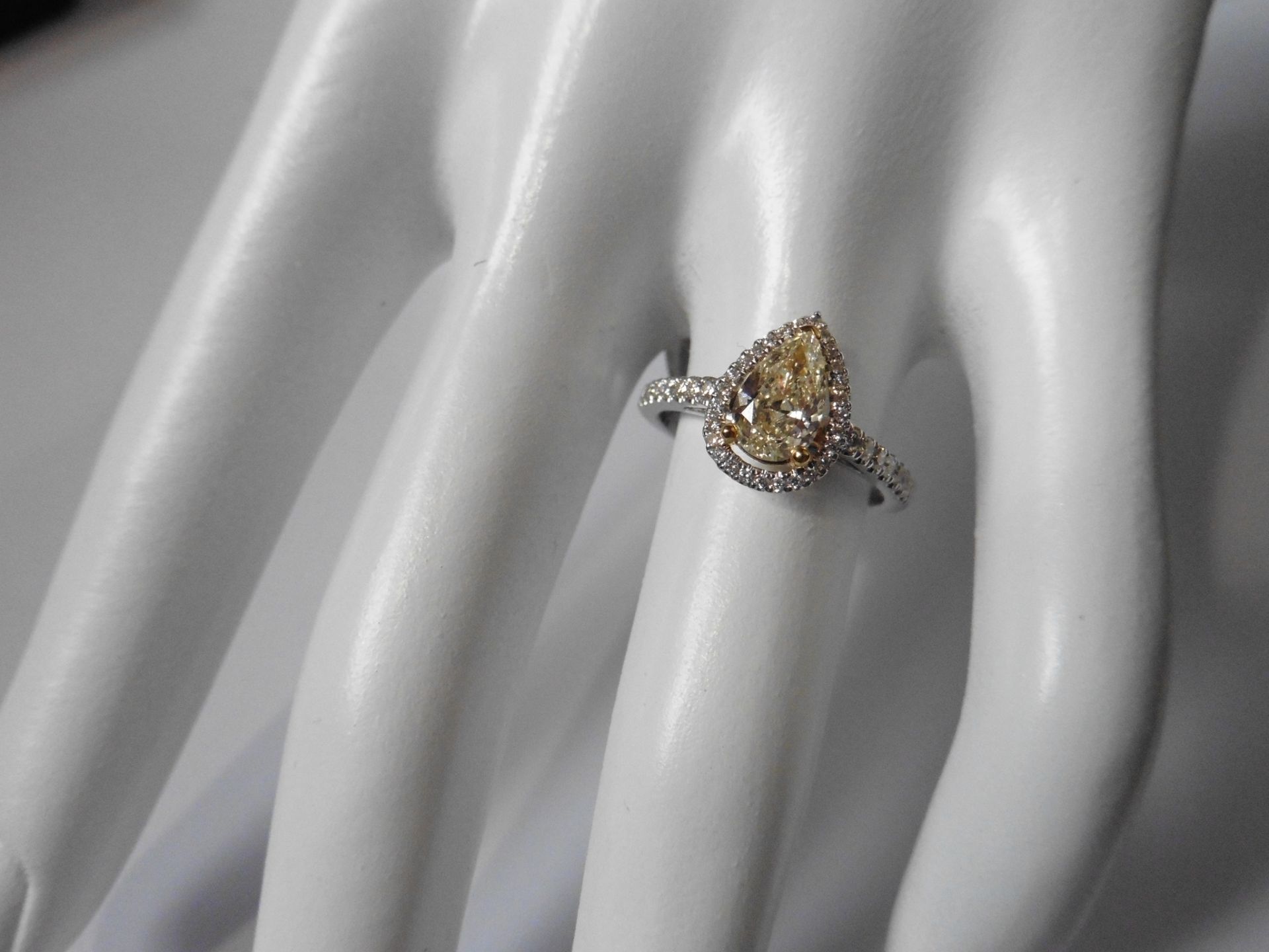 0.75ct yellow pear shaped diamond set solitaire ring. Has a halo setting of small brilliant cut - Image 5 of 5