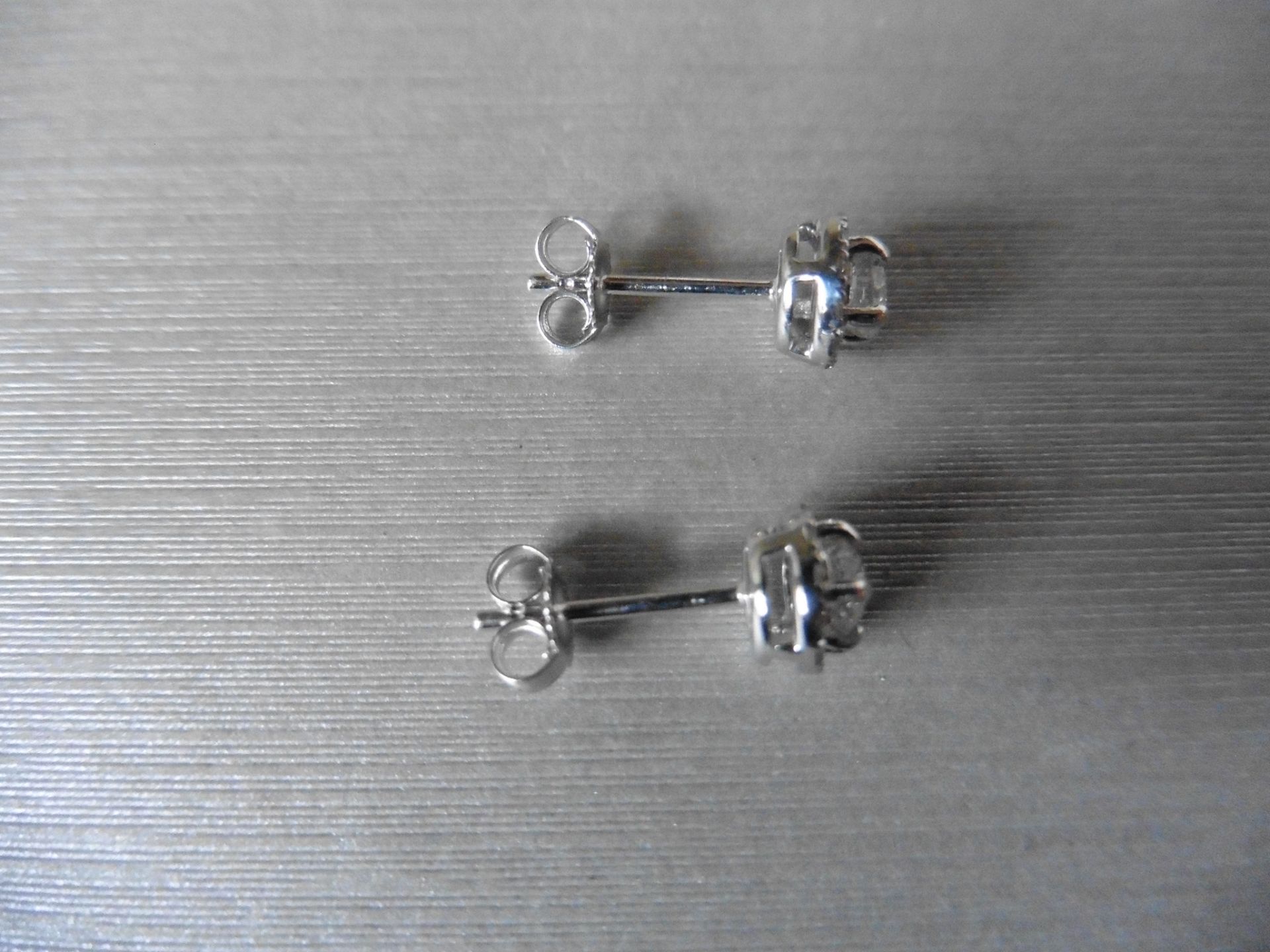 0.75ct diamond set stud style earrings. Centre stones 0.50ct total, I colour si2 clarity. Halo - Image 2 of 2