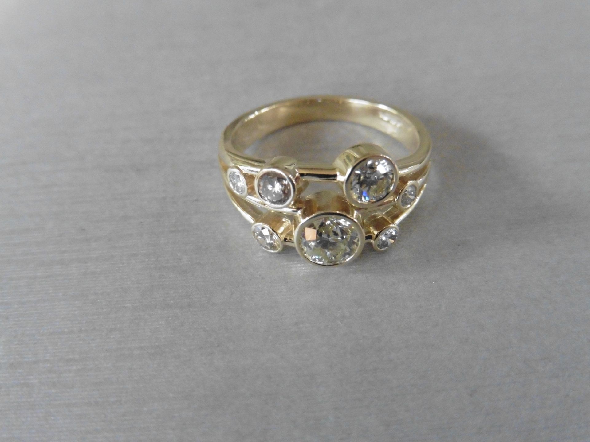 1.00ct 9ct yellow gold diamond dress ring, rain dance style. Set with 7 graduated brilliant cut - Image 2 of 3