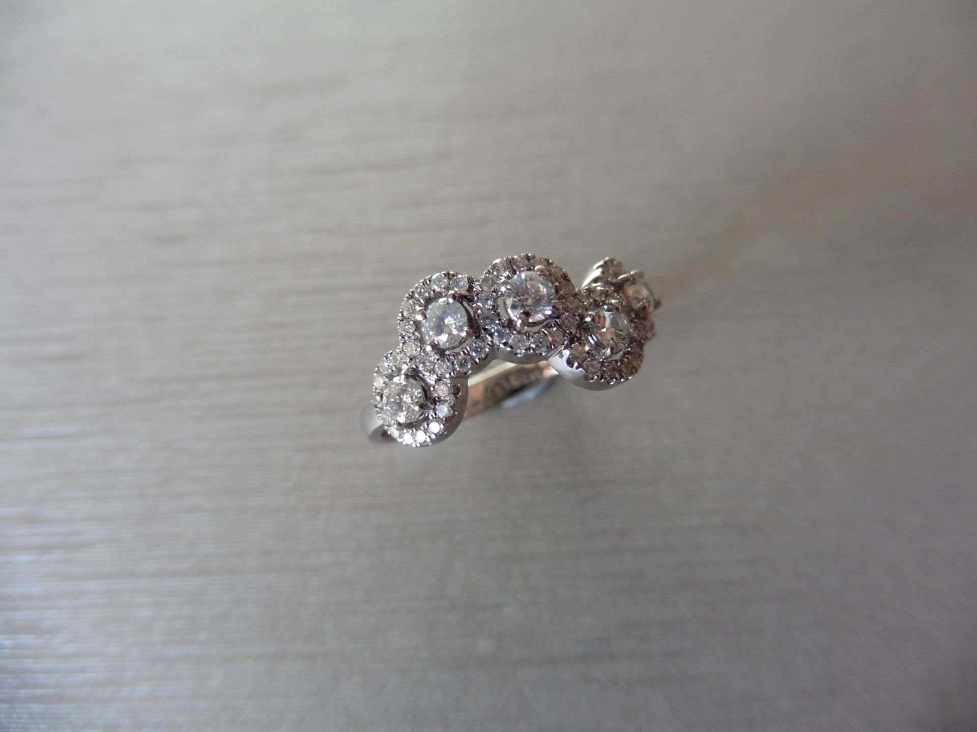 0.58ct diamond dress ring. Set with 5 centred brilliant cut diamonds. 0.30ct total. I colour, si2