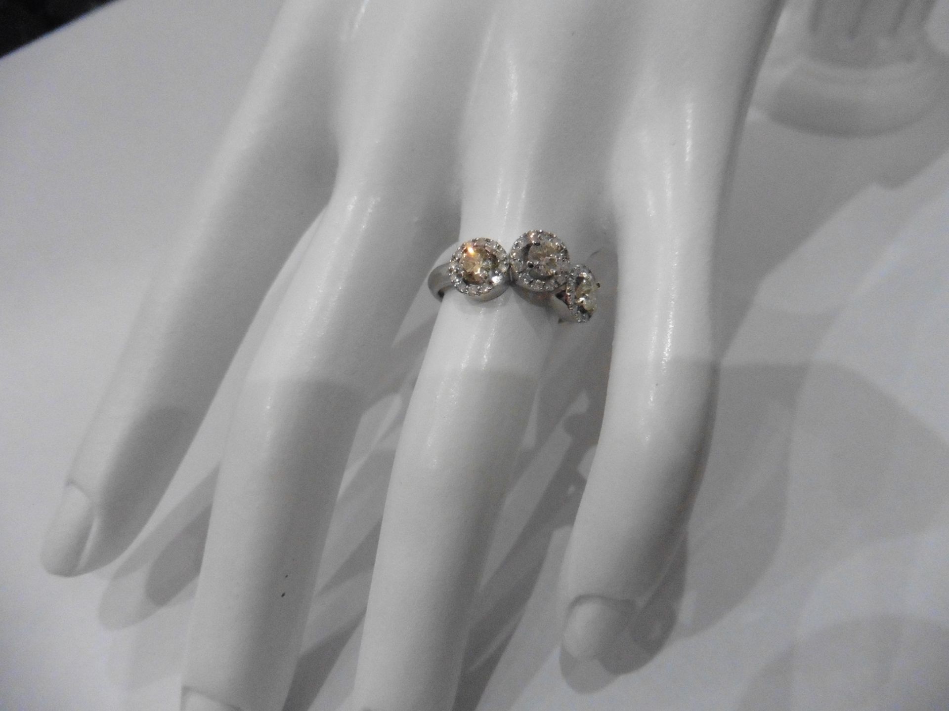 1.03ct diamond halo set trilogy style dress ring. Set with 3 centred brilliant cut diamonds, I - Image 5 of 5
