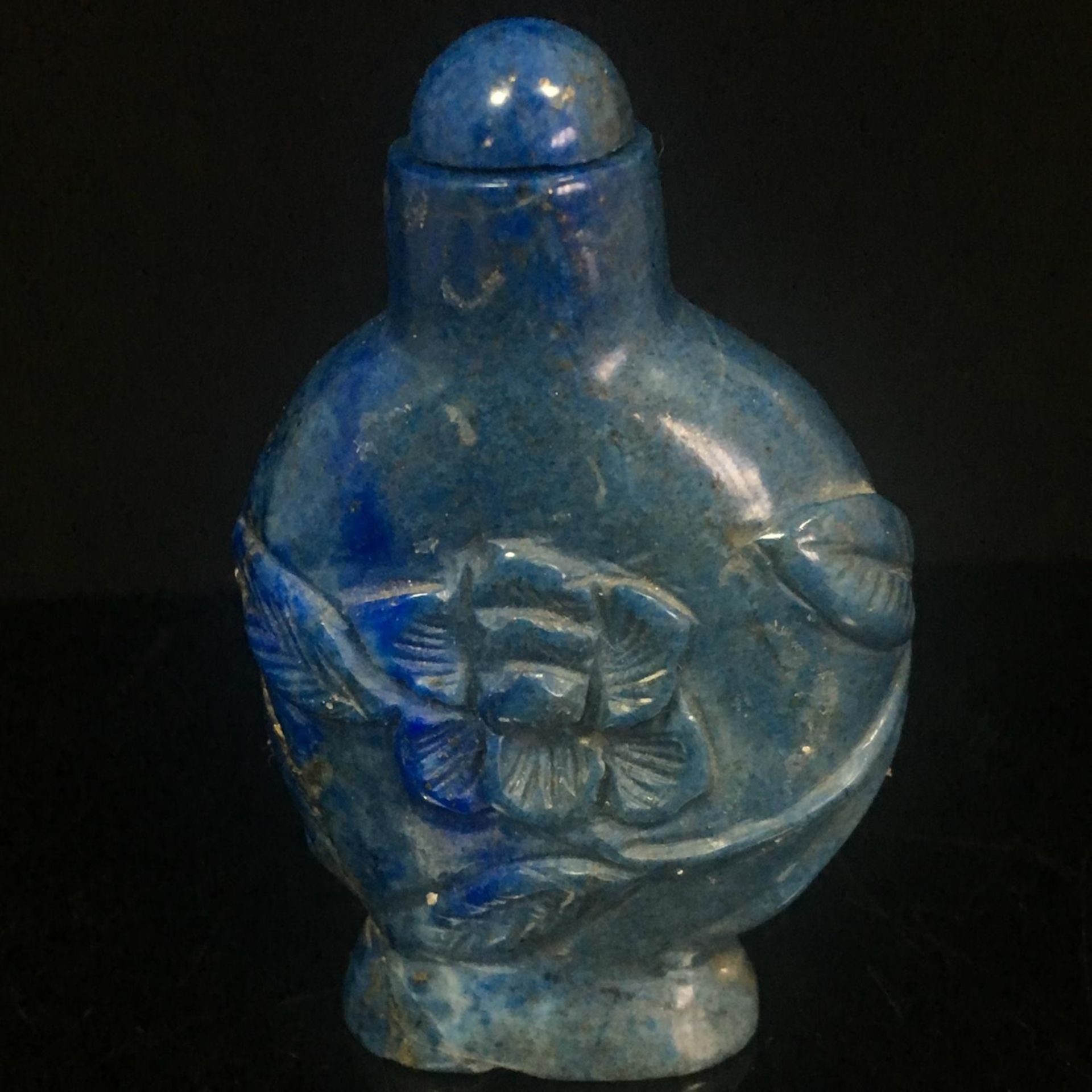 Antique Chinese natural hand-carved lapis lazuli snuff bottle. The carving depicts a lotus flower. - Image 2 of 3
