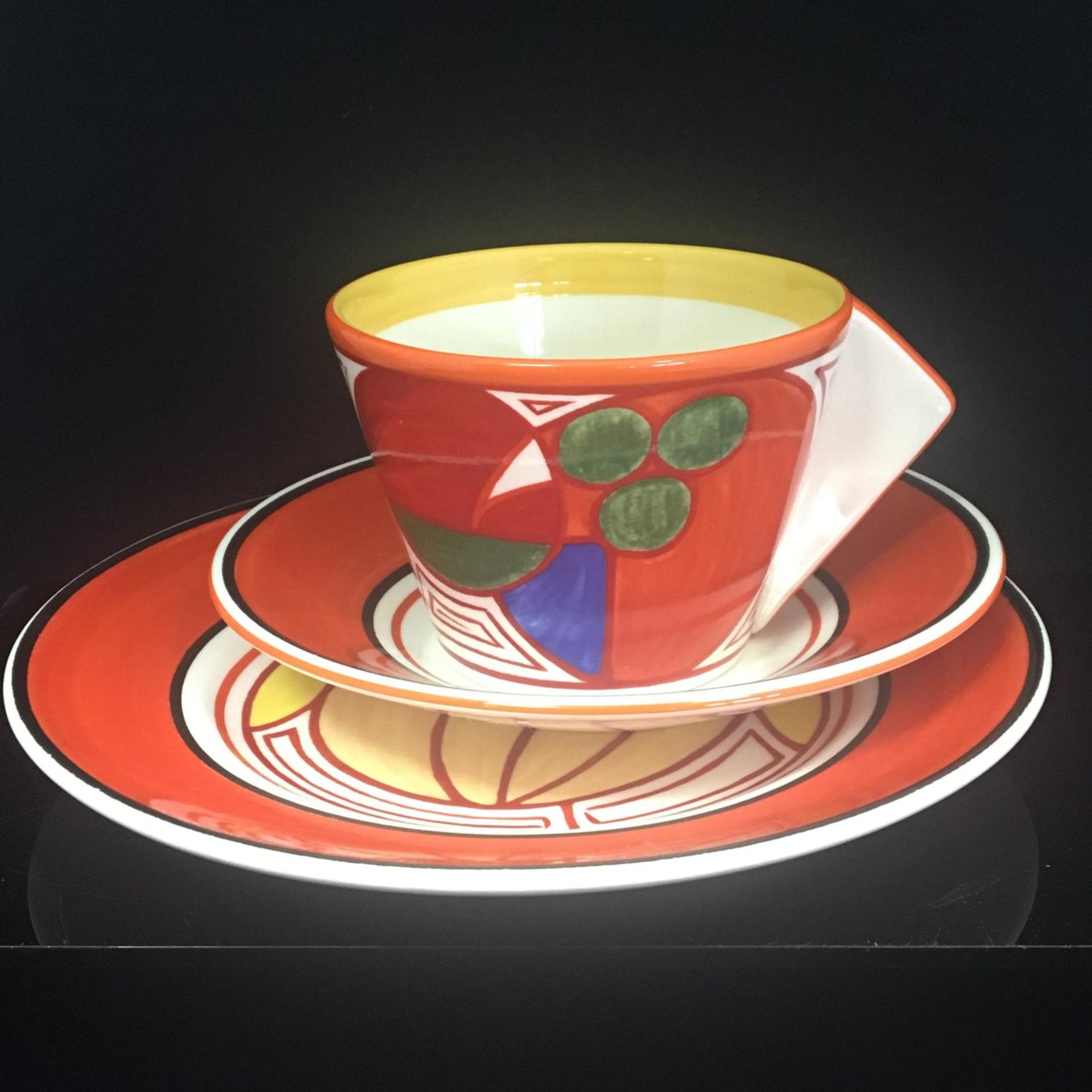 Bizarre by Clarice Cliff for Wedgwod. A trio consisting of teacup, saucer and side plate.