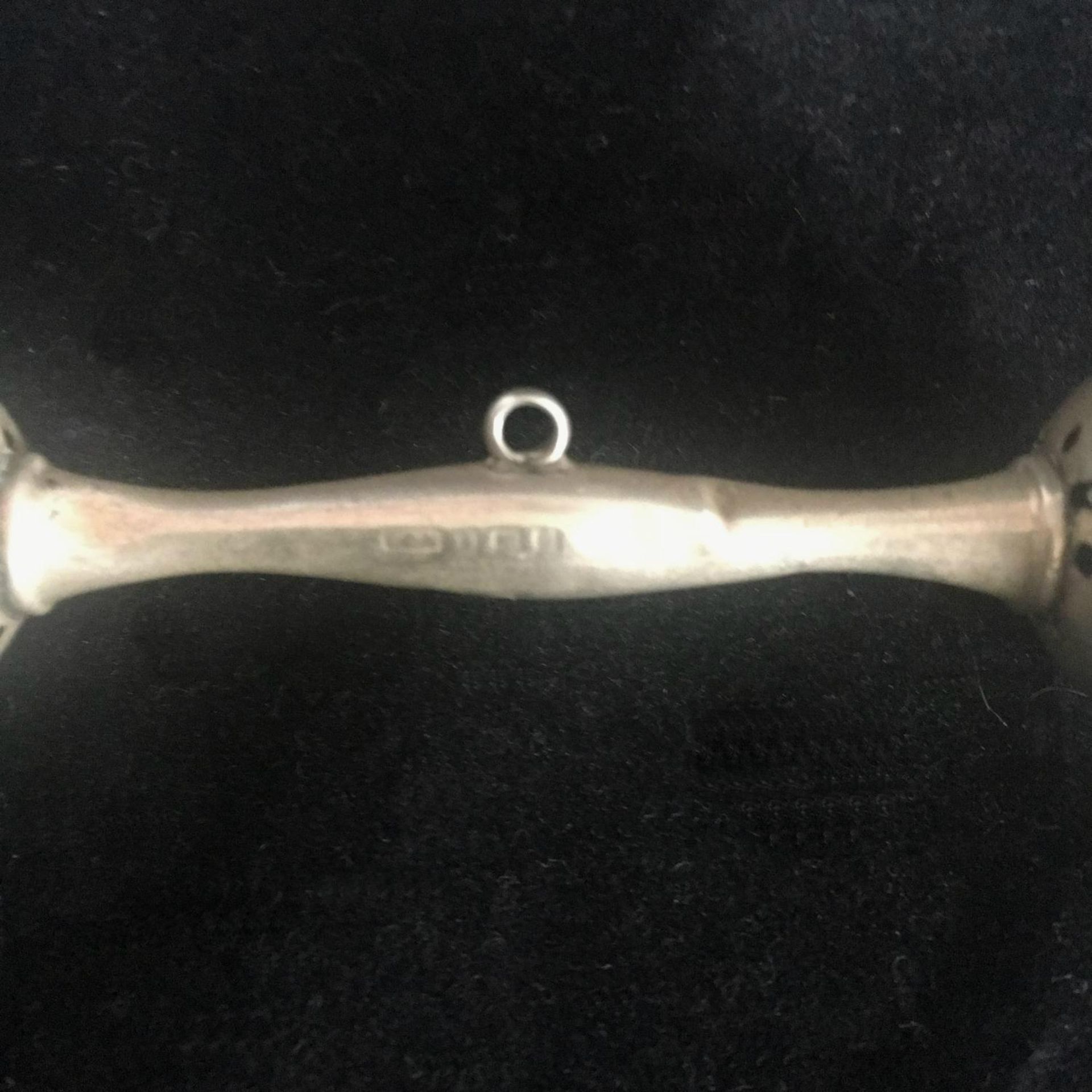 EARLY 20thC HALLMARKED STERLING SILVER RATTLE. With a bell at either end and loop to attach a - Image 2 of 2