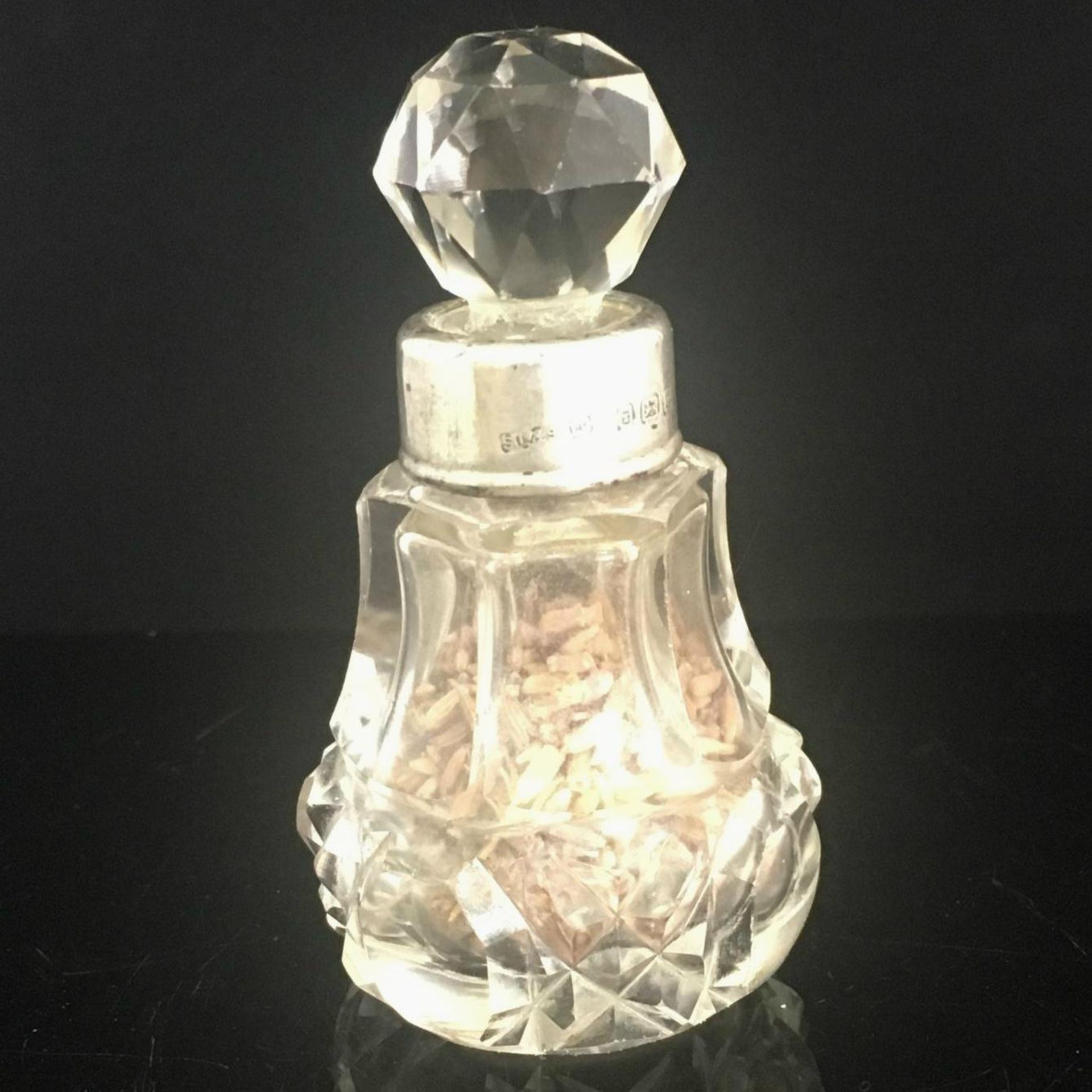 1924 SILVER COLLAR CRYSTAL GLASS VANITY PERFUME BOTTLE. Complete with original stopper and fully
