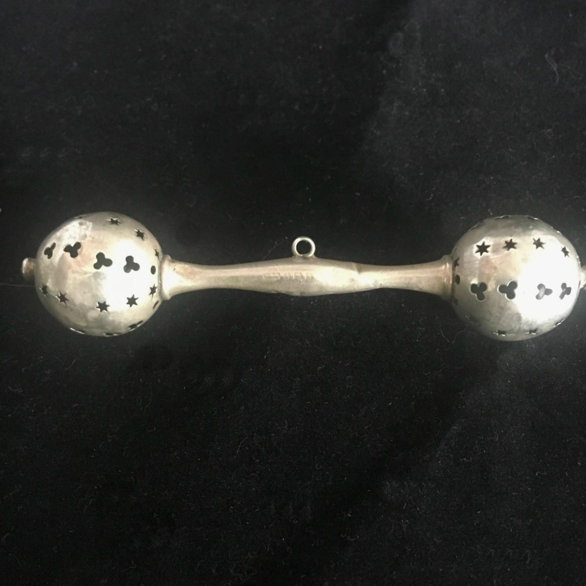 EARLY 20thC HALLMARKED STERLING SILVER RATTLE. With a bell at either end and loop to attach a