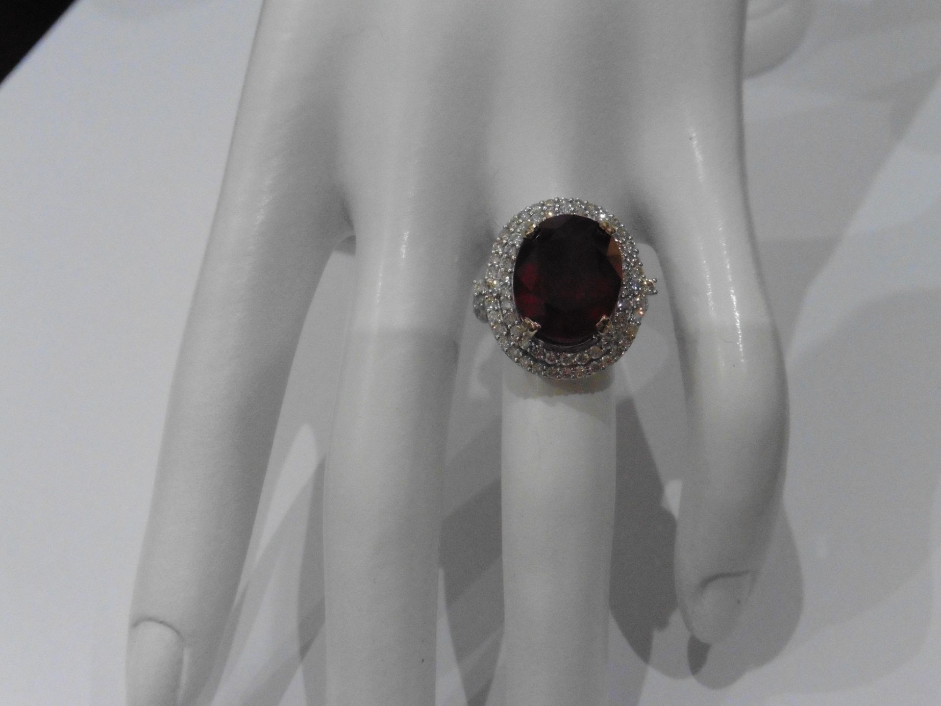 12.30ct Ruby and diamond fancy dress ring. Oval cut ruby ( treated ) set in a four claw setting - Image 5 of 5