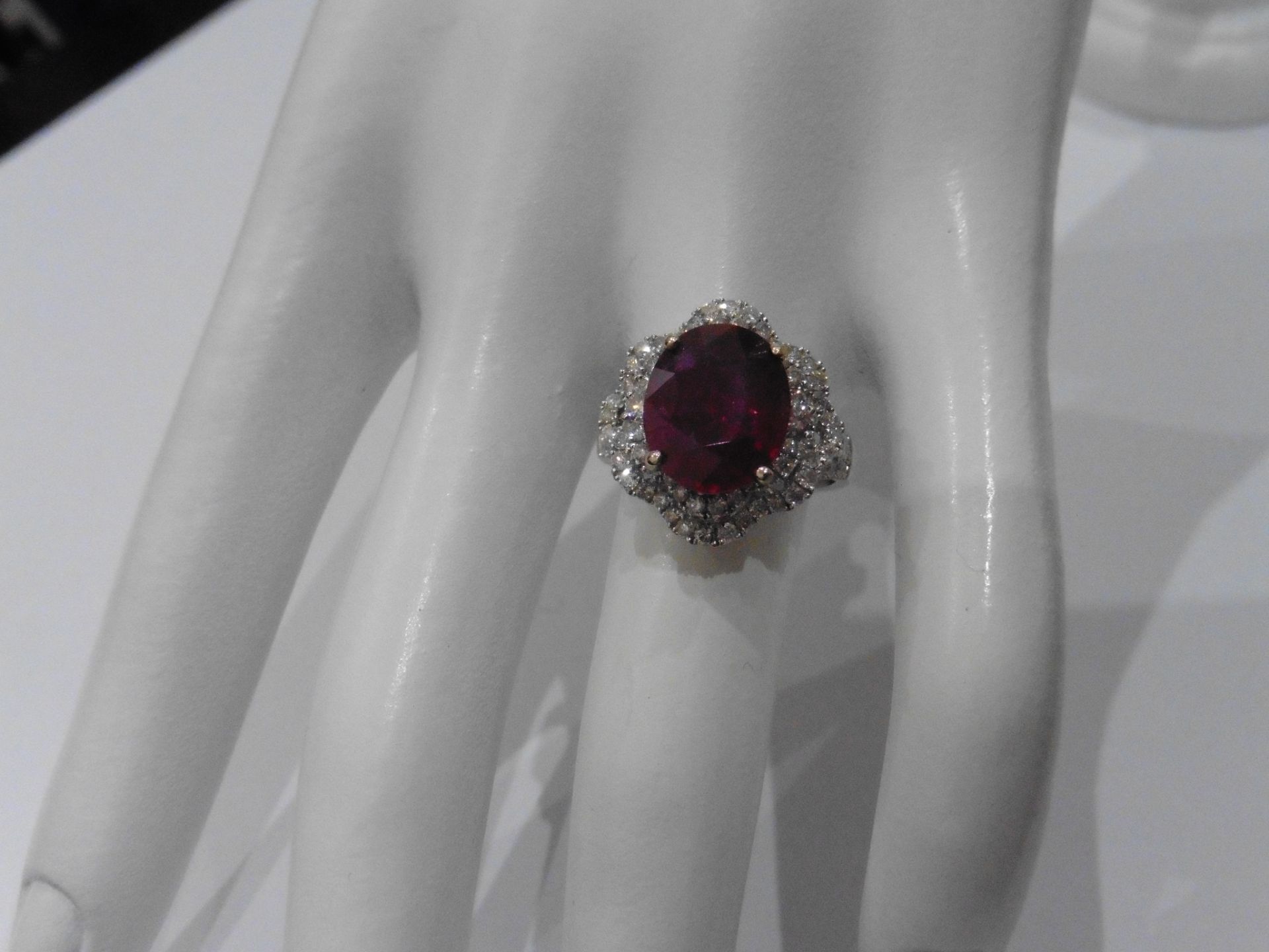 5.61ct Ruby and diamond fancy dress ring. Oval cut ruby ( treated ) set in a four claw setting - Image 6 of 6