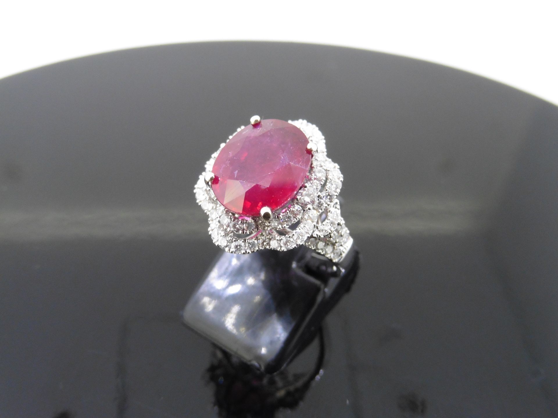 5.61ct Ruby and diamond fancy dress ring. Oval cut ruby ( treated ) set in a four claw setting - Image 4 of 6