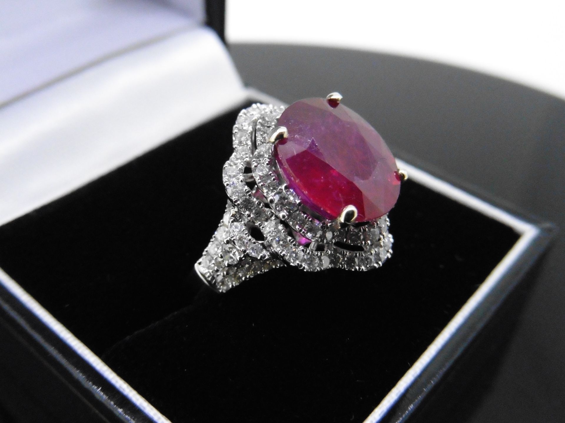 5.61ct Ruby and diamond fancy dress ring. Oval cut ruby ( treated ) set in a four claw setting - Image 5 of 6