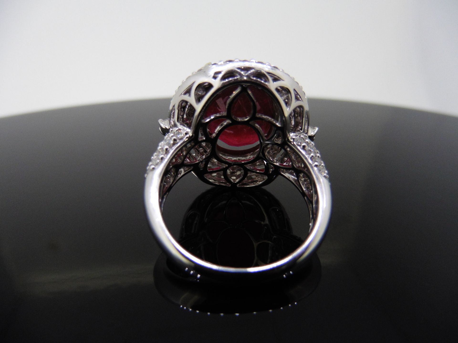 12.30ct Ruby and diamond fancy dress ring. Oval cut ruby ( treated ) set in a four claw setting - Image 2 of 5