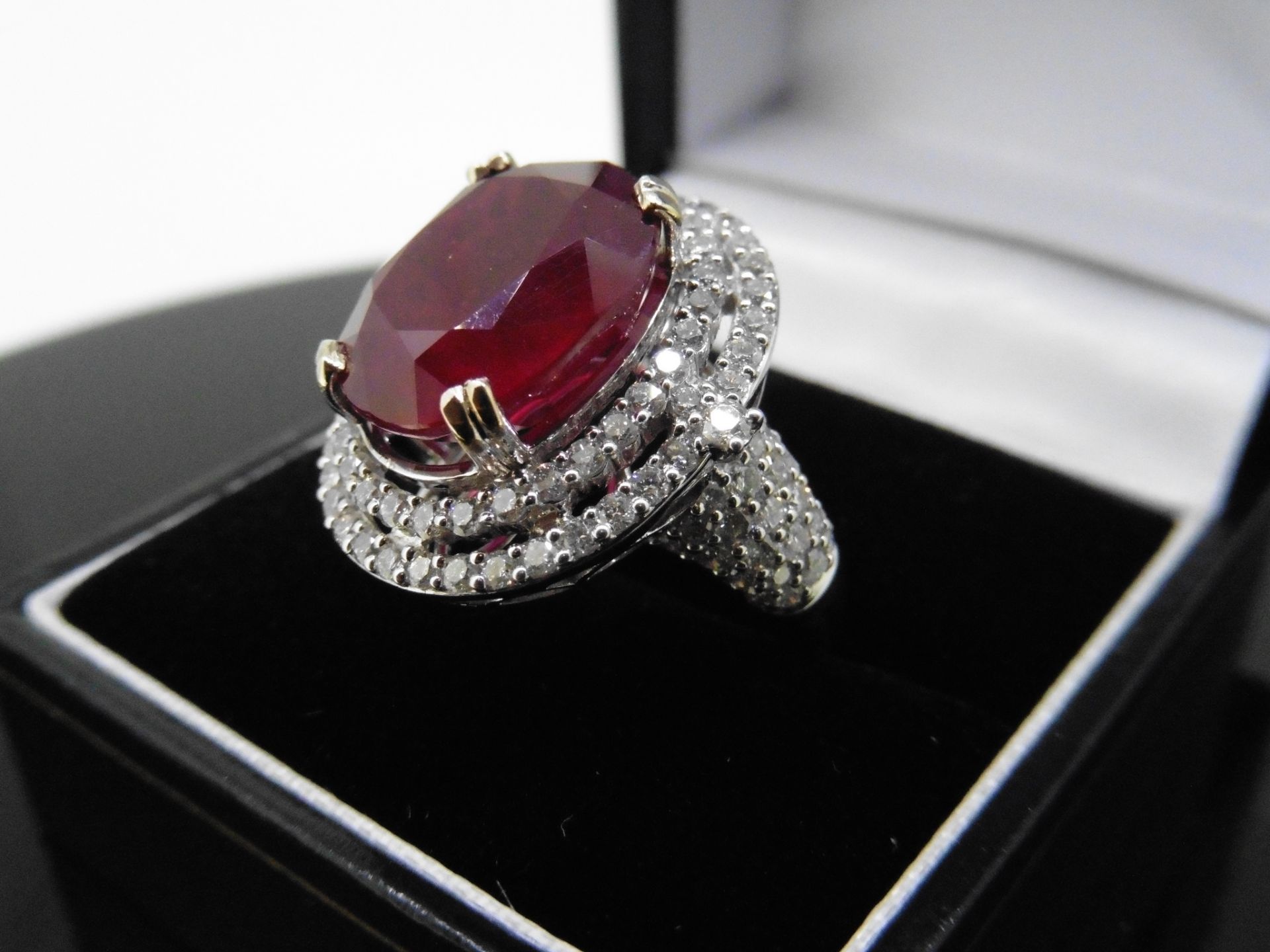 12.30ct Ruby and diamond fancy dress ring. Oval cut ruby ( treated ) set in a four claw setting - Image 4 of 5