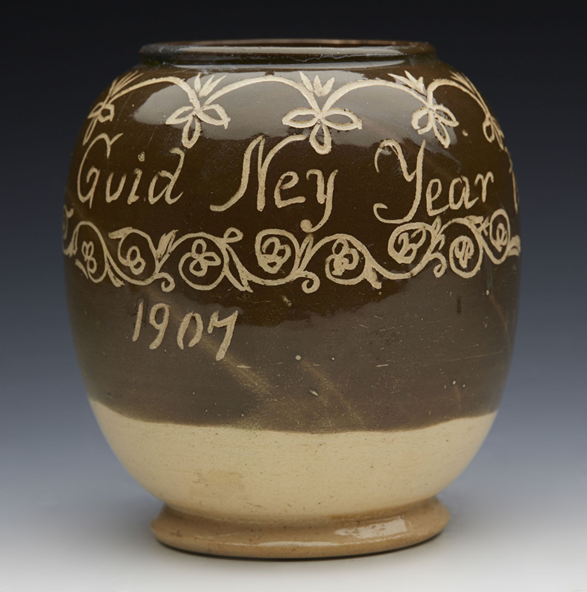 ANTIQUE SCOTTISH 'A GUID NEY YEAR' STUDIO POTTERY POT WITH THREE HEADS, 1907