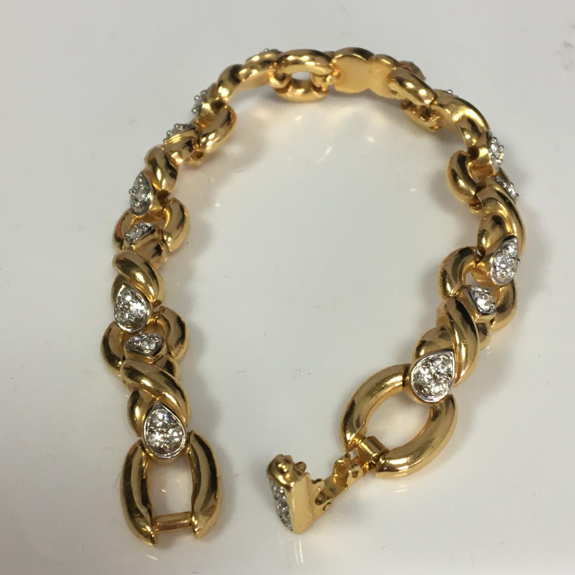 Vintage Swarovski crystal yellow metal bracelet having the Swarovski swan mark. Includes free UK