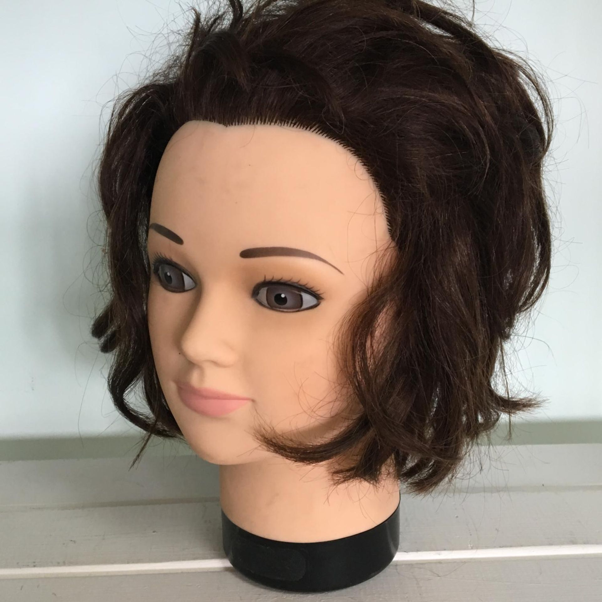 Vintage display model head with real hair. Includes free UK delivery.