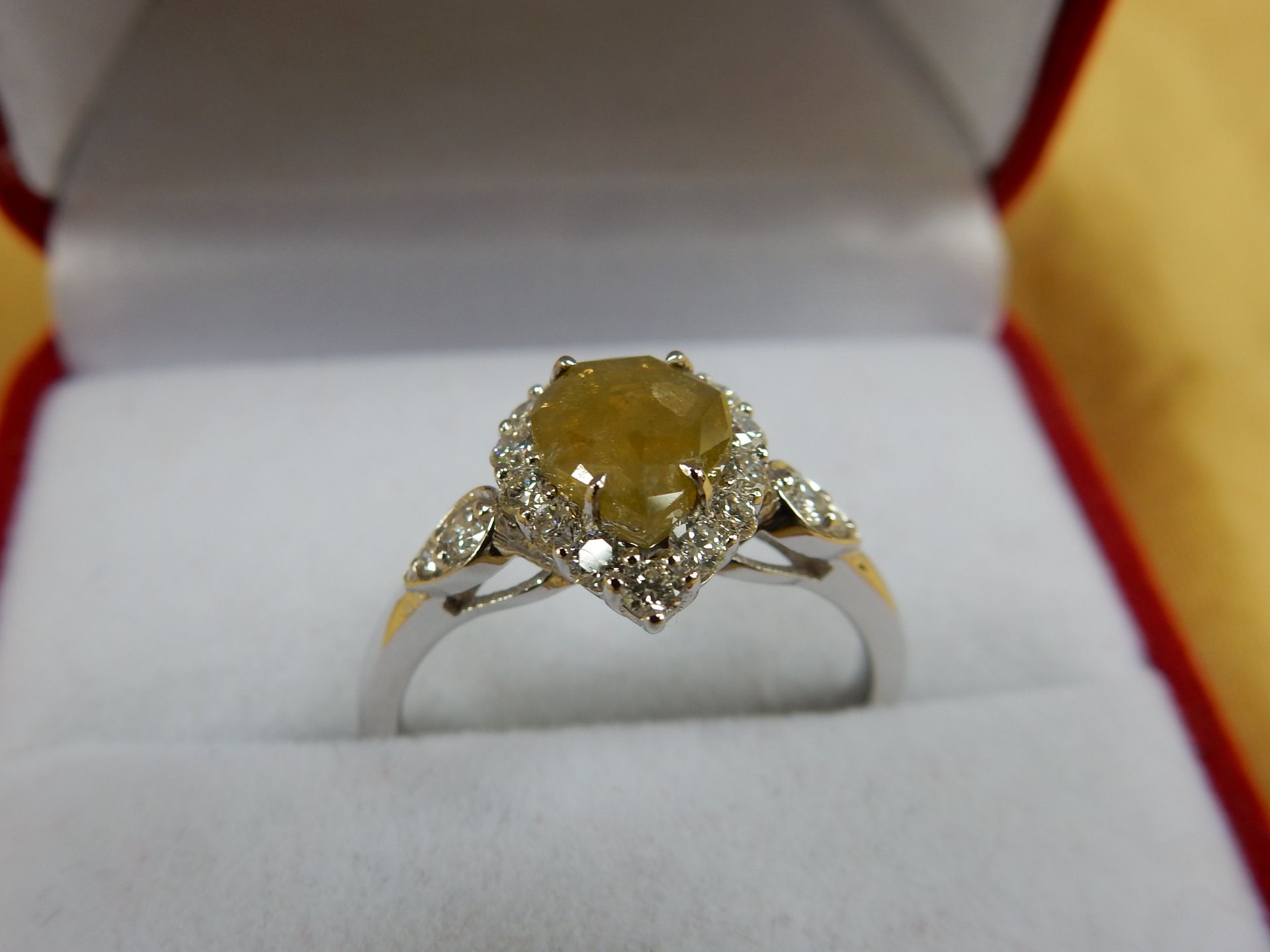 A 14 carat white gold single stone ring with marquise brilliant cut diamond
