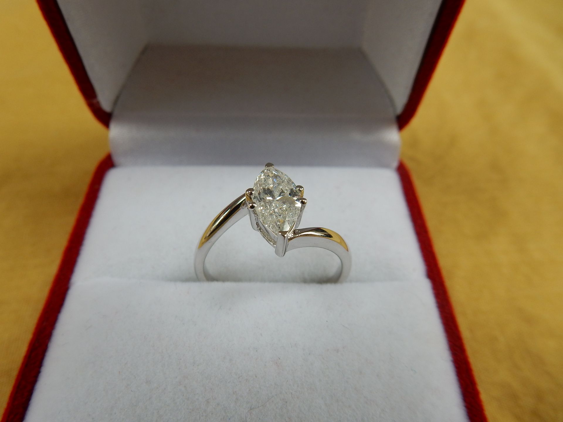 An 18 carat white gold diamond pear shaped cluster head ring.