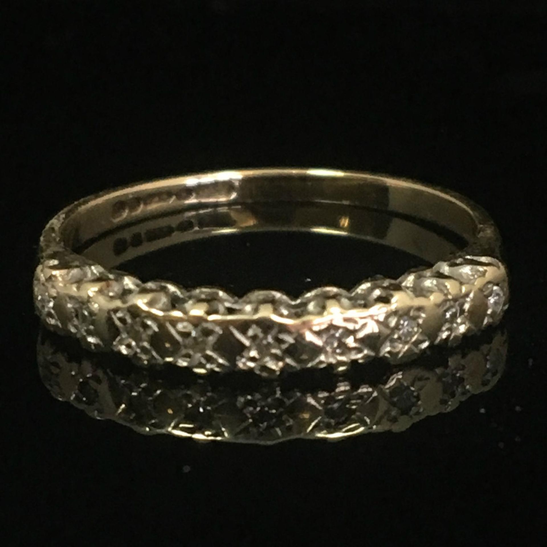 9ct gold diamond half eternity ring, London hallmarks c1989. Nine cut diamonds in illusion bead