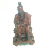 Chinese carved hardwood figure with inlaid glass eyes and bone teeth. Height 6.5 inches. Includes