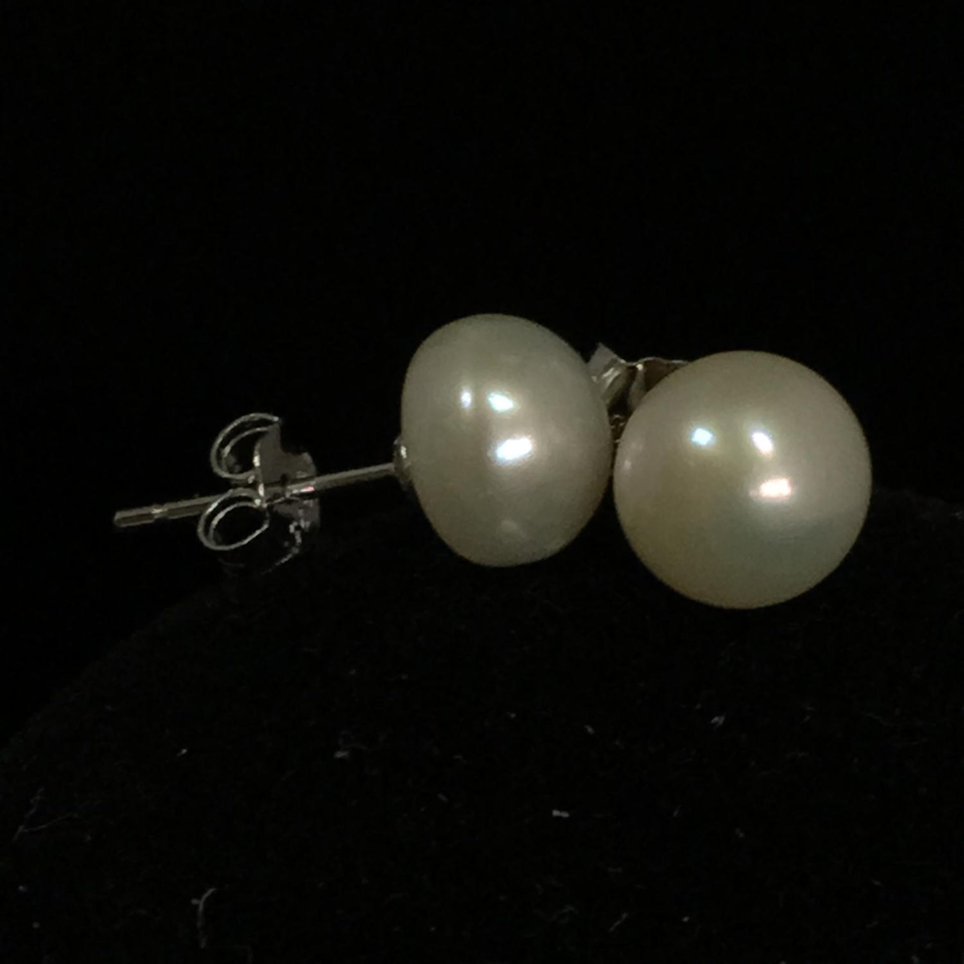 7mm freshwater white pearl stud earrings on 925 silver. Includes free UK delivery.