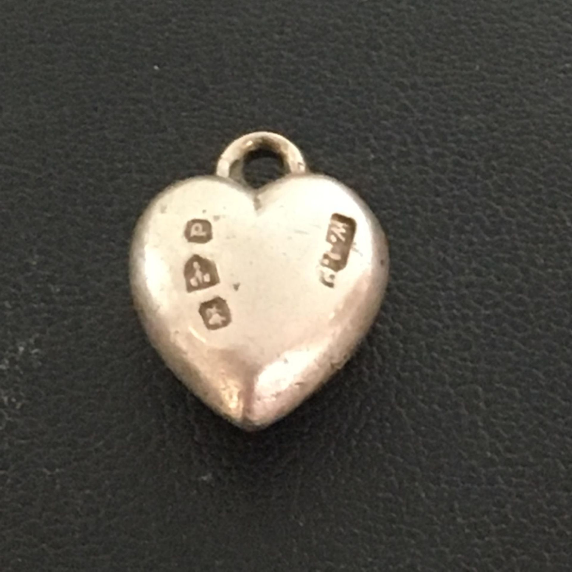 HALLMARKED STERLING SILVER HEART SHAPED PENDANT. Chester hallmarks 1898. The hammer price includes
