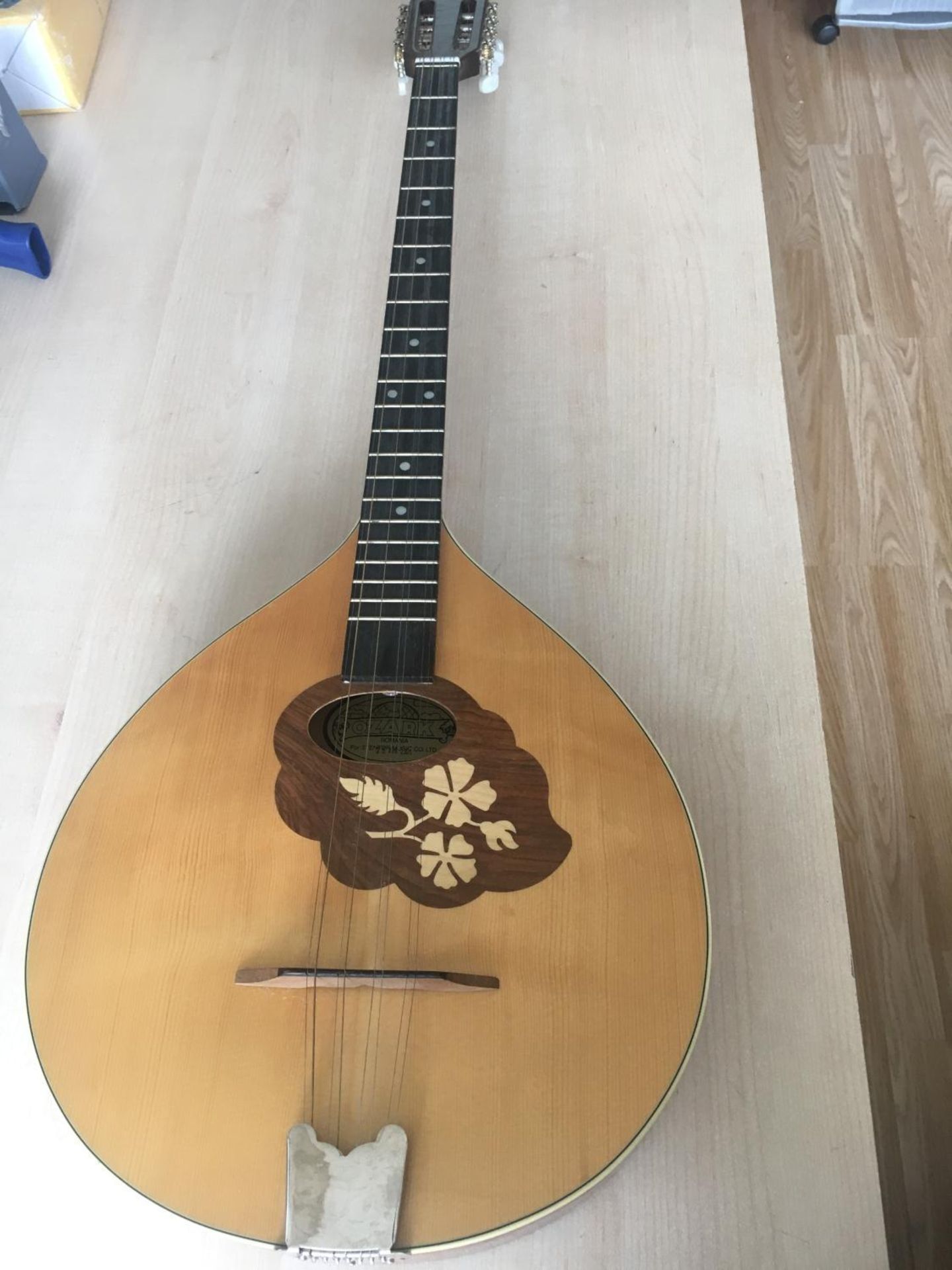 OZARK EIGHT STRING MANDOLIN. Made in Romania. Spruce top with an inlaid escutcheon. The back and