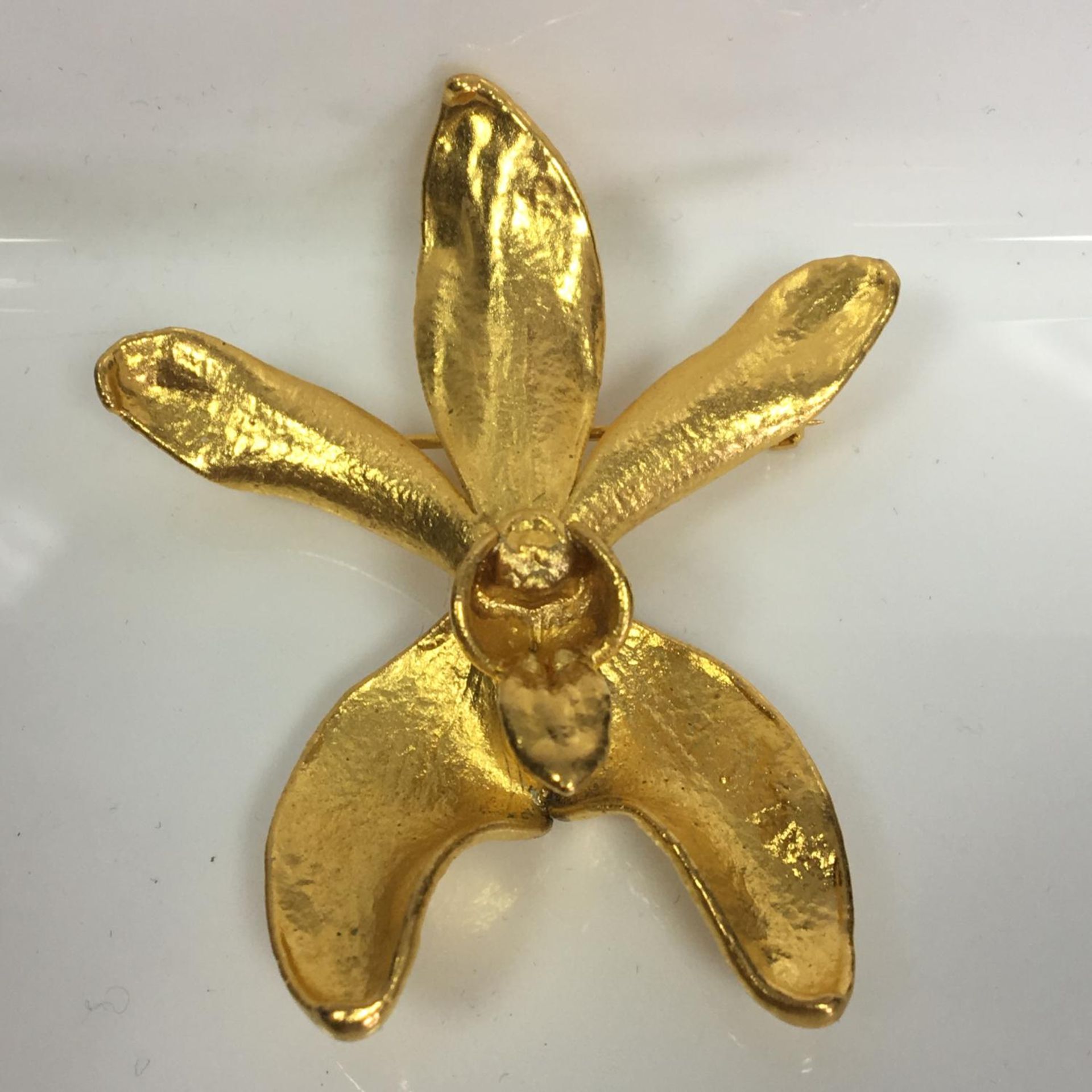 Quirky vintage jewellery - a real orchid flower dipped in gold, can be worn as a pendant or