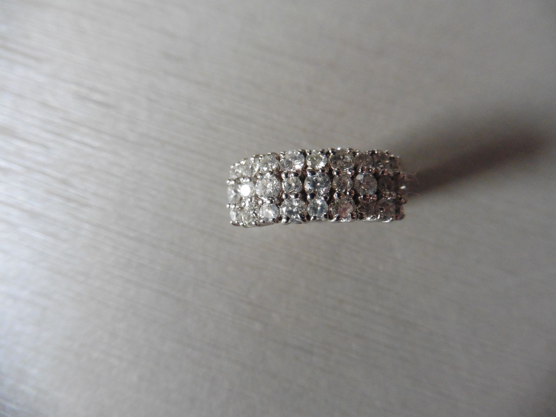 1.33ct Diamond band ring. Set with 3 rows of brilliant cut diamonds, I colour, si1-2 clarity. Claw - Image 2 of 6