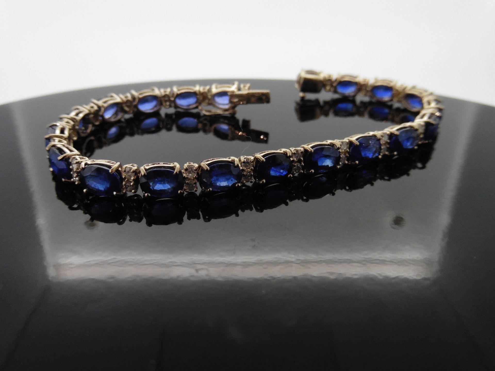 18ct white gold Sapphire and diamond bracelet. Set with 7 x 5mm oval cut treated sapphires, total - Image 6 of 7