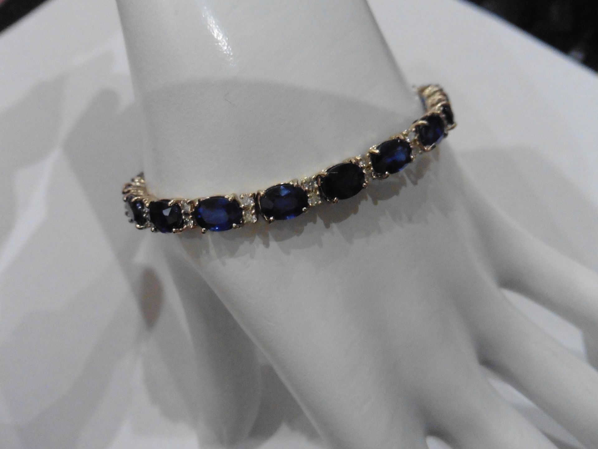 18ct white gold Sapphire and diamond bracelet. Set with 7 x 5mm oval cut treated sapphires, total - Image 4 of 7