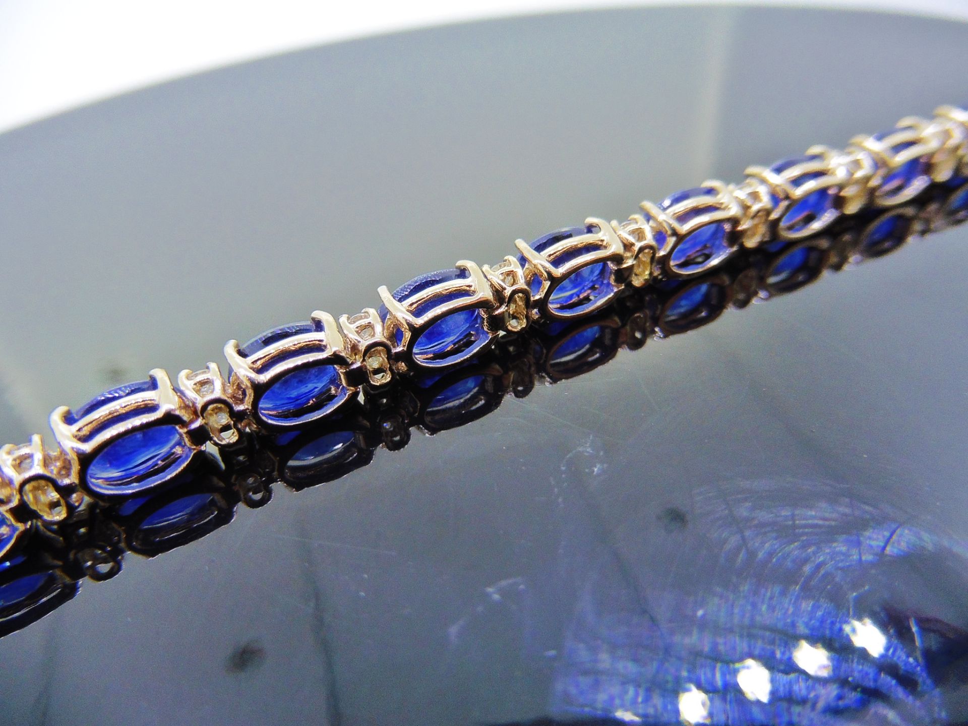 18ct white gold Sapphire and diamond bracelet. Set with 7 x 5mm oval cut treated sapphires, total - Image 2 of 7