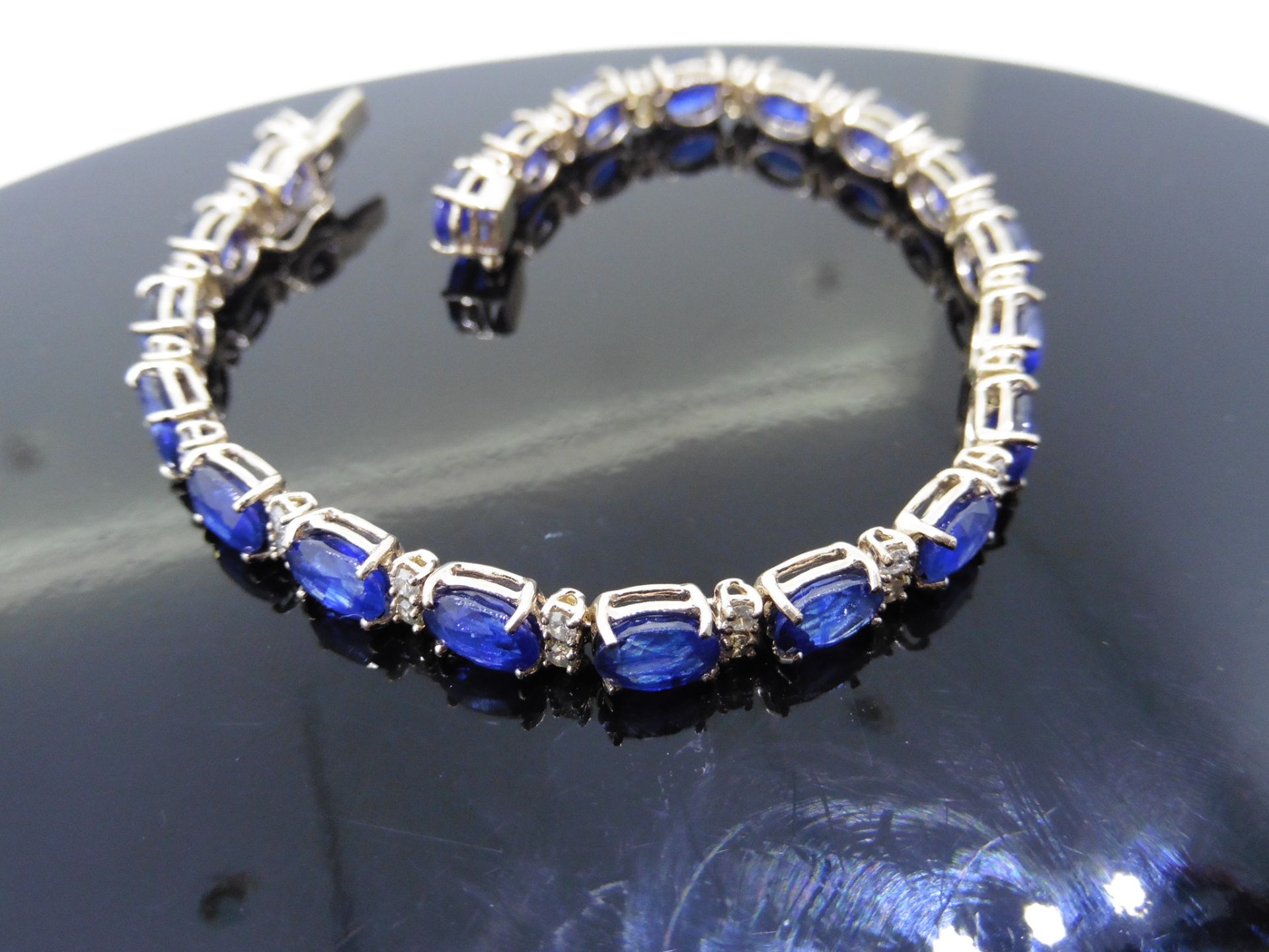18ct white gold Sapphire and diamond bracelet. Set with 7 x 5mm oval cut treated sapphires, total - Image 7 of 7
