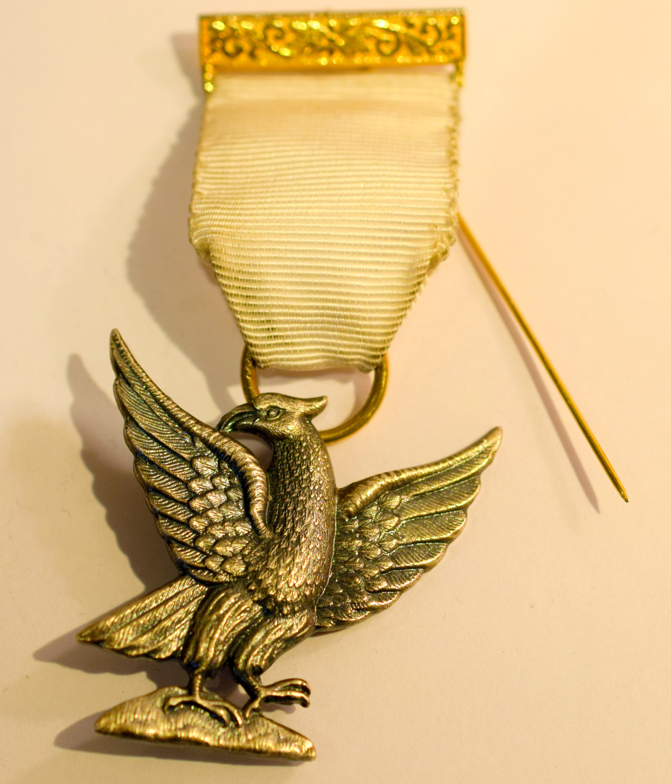 Masonic Medal Eagle On White Ribbon   Masonic medal featuring an eagle with outstretched wings below