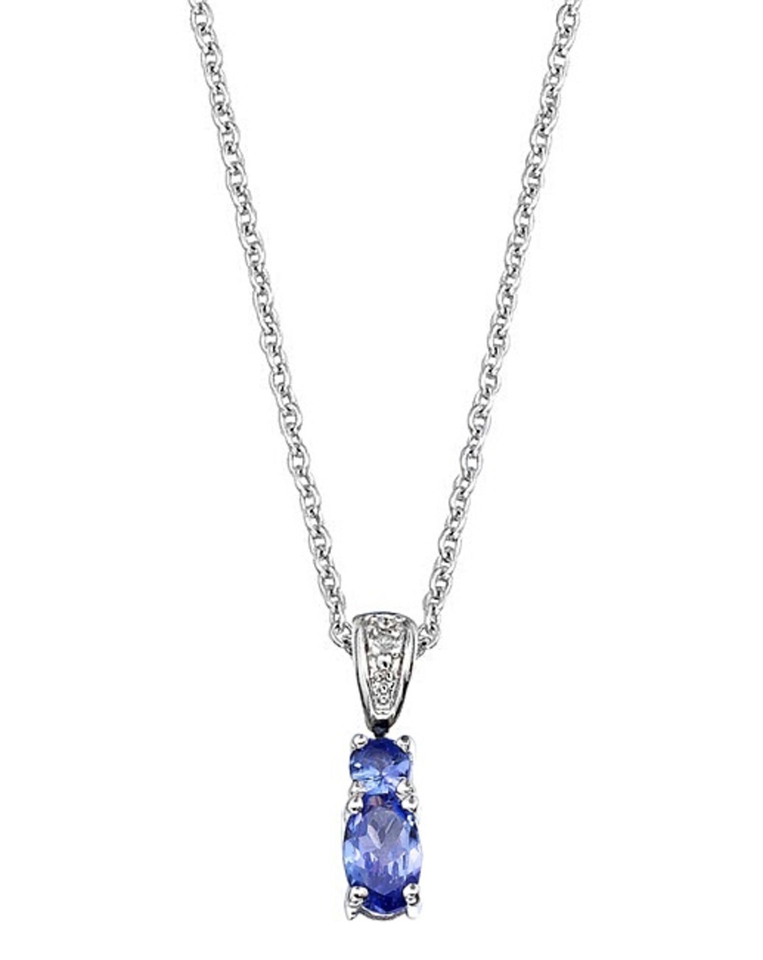 This stunning 925 Solid Sterling Silver drop pendant set with AA Tanzanite & White Topaz is a