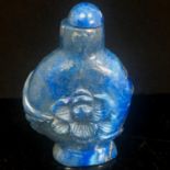 Antique Chinese natural hand-carved lapis lazuli snuff bottle. The carving depicts a lotus flower.