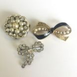 A group of three vintage or antique brooches. In good condition. Includes free UK delivery.