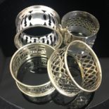 Group of 4 various pierced vintage EPNS napkin rings. Includes free UK delivery.